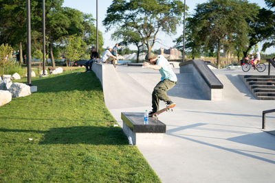 View of man skateboarding on skateboard park