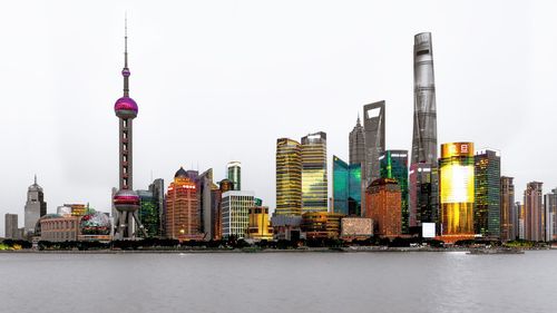 Modern buildings in city against clear sky