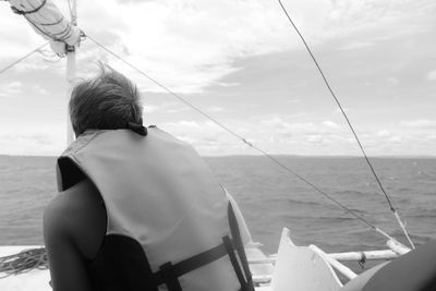 Side view of boat sailing in sea