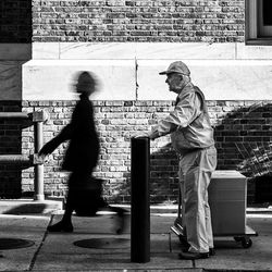 Full length of man standing in city