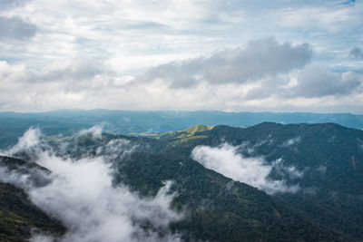 Scenic view of sea and mountains against sky