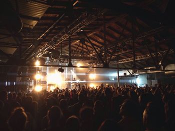 Rear view of people enjoying music concert