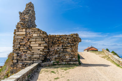 Low angle view of old ruins against sky