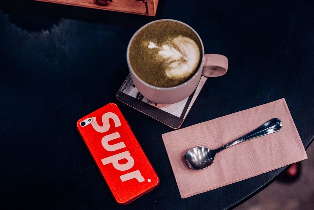 HIGH ANGLE VIEW OF COFFEE ON TABLE AT HOME