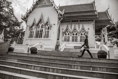 Low angle view of people outside building