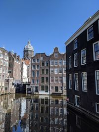 Low angle view of buildings against blue sky