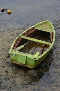 High angle view of abandoned boat moored on shore