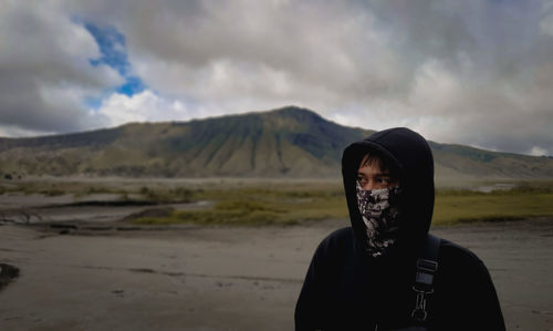 Portrait of man on land against sky