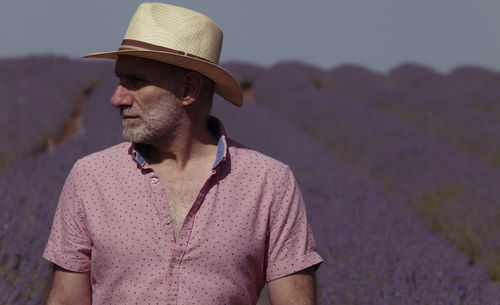 Adult man in hat on lavender fields. brihuega, spain