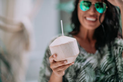 Portrait of woman holding ice cream