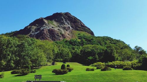 Scenic view of mountains against clear blue sky