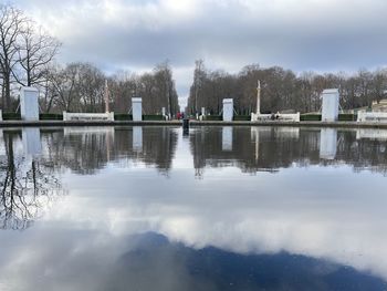 Reflection of trees in lake against sky