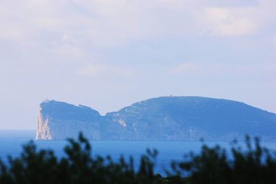 Scenic view of sea against mountain range