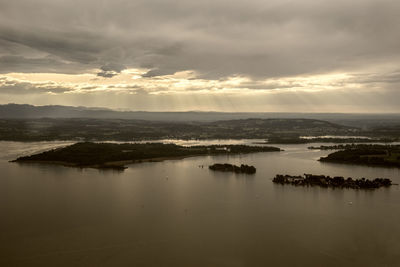 Scenic view of lake against sky during sunset