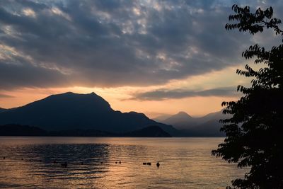 Scenic view of lake against sky during sunset