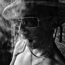 Portrait of man smoking cigarette