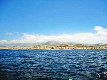 Scenic view of sea against blue sky