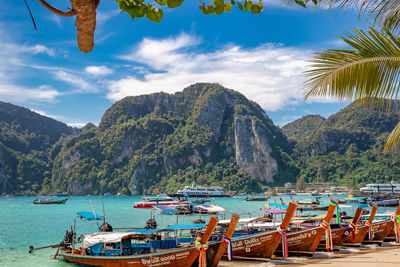 Scenic view of sea and mountains against sky