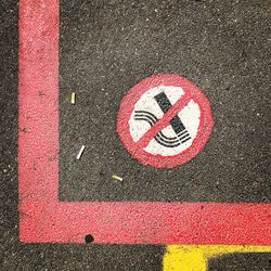 High angle view of no smoking sign on road