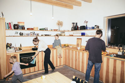 Family having fun while preparing food in kitchen at home