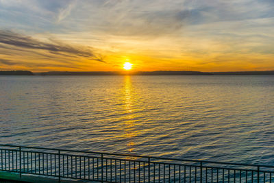 A setting sun across the puget sound in west seattle, washington.