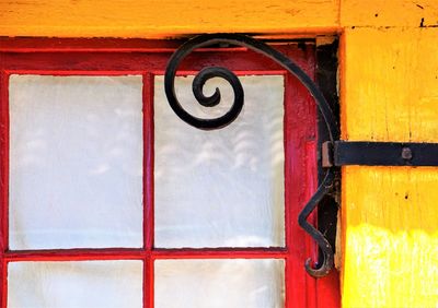 Close-up of iron scroll window corner