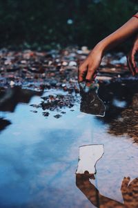 Reflection of woman in puddle