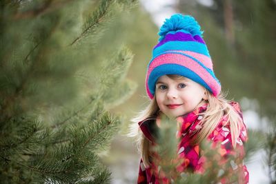 Girl wearing multi colored hat