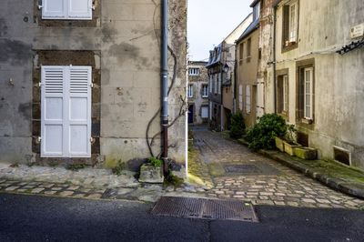 Street amidst residential buildings