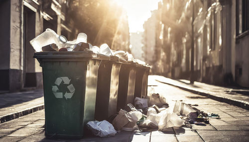 Recycling containers full of waste in a city street. waste recycling, circular economy concept