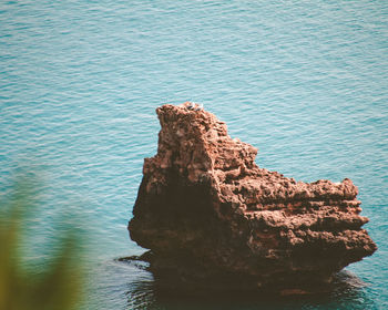 High angle view of rock formation in sea