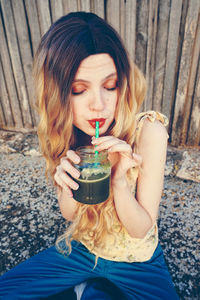 Beautiful woman having smoothie