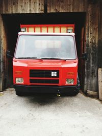 Red car on brick wall