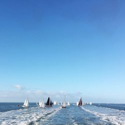 Scenic view of sea against clear blue sky