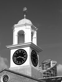 Low angle view of bell tower against sky