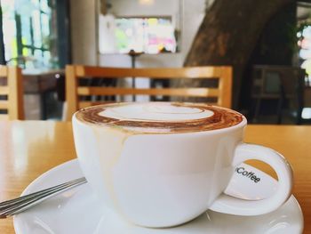 Close-up of coffee cup on table