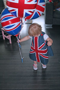 High angle view of girl with british baloons