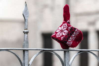 Close-up of red metal hanging outdoors