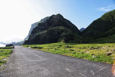 Scenic view of mountain road against clear sky