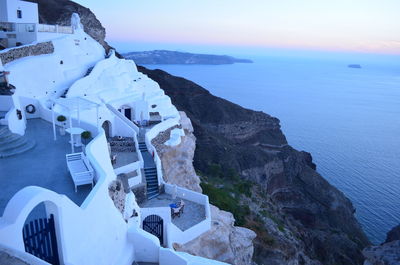 High angle view of whitewashed houses at santorini against aegean sea