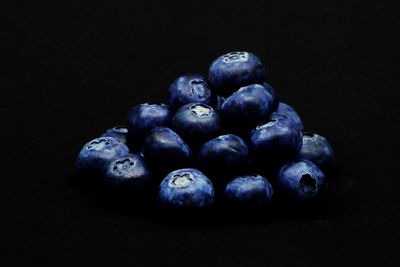 Close-up of blueberries against black background