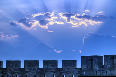 Low angle view of buildings in city against sky