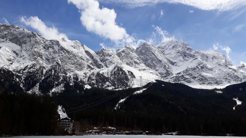 Scenic view of snowcapped mountains against sky