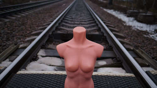 Midsection of person on railroad track