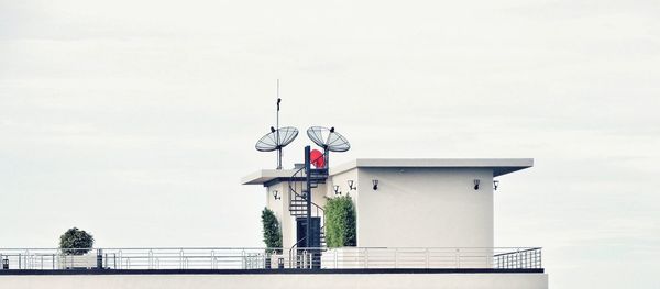 Lifeguard hut by sea against sky