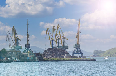 Cranes are lifted by scrap metal in seaport