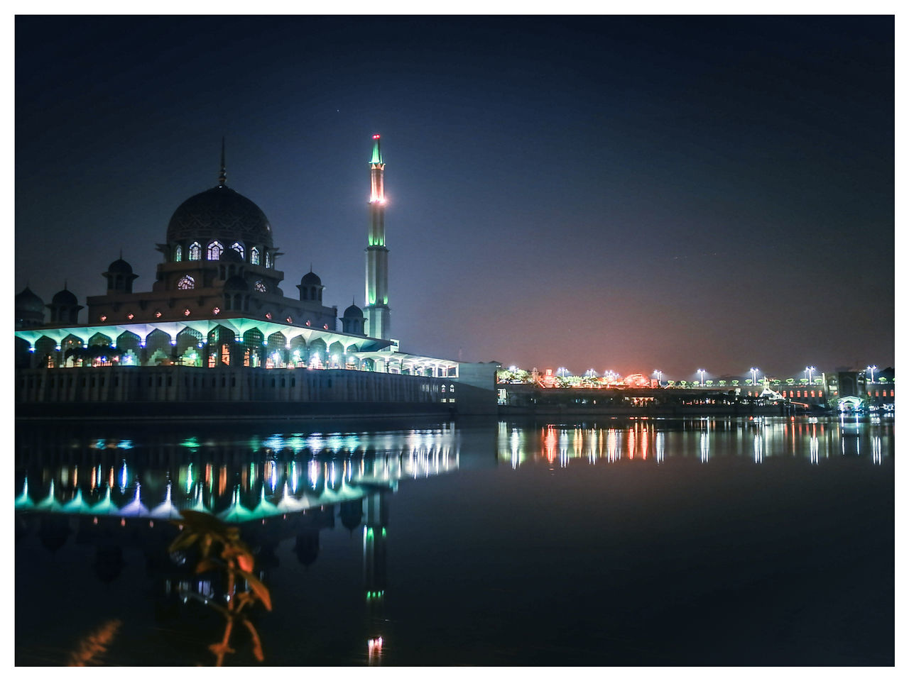 building exterior, architecture, built structure, water, sky, reflection, illuminated, city, religion, night, auto post production filter, belief, travel destinations, building, spirituality, travel, nature, place of worship, no people, outdoors, spire, skyscraper
