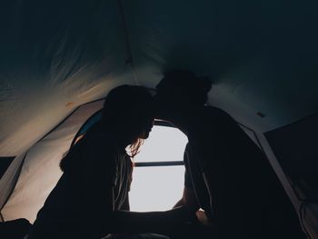 Woman looking through window