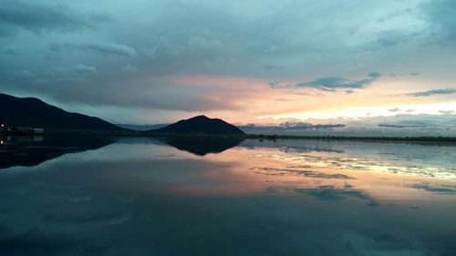 Scenic view of sea against cloudy sky