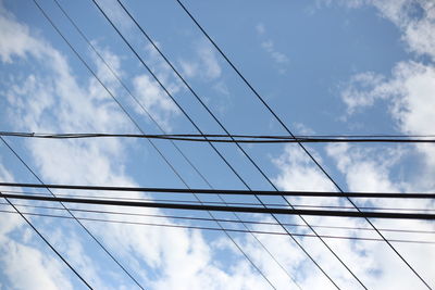 Low angle view of cables against sky